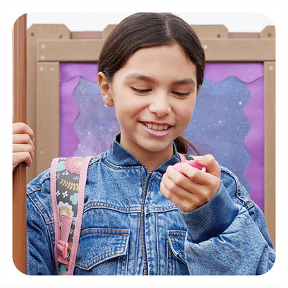 Girl holding BoT Talk device with silicone case